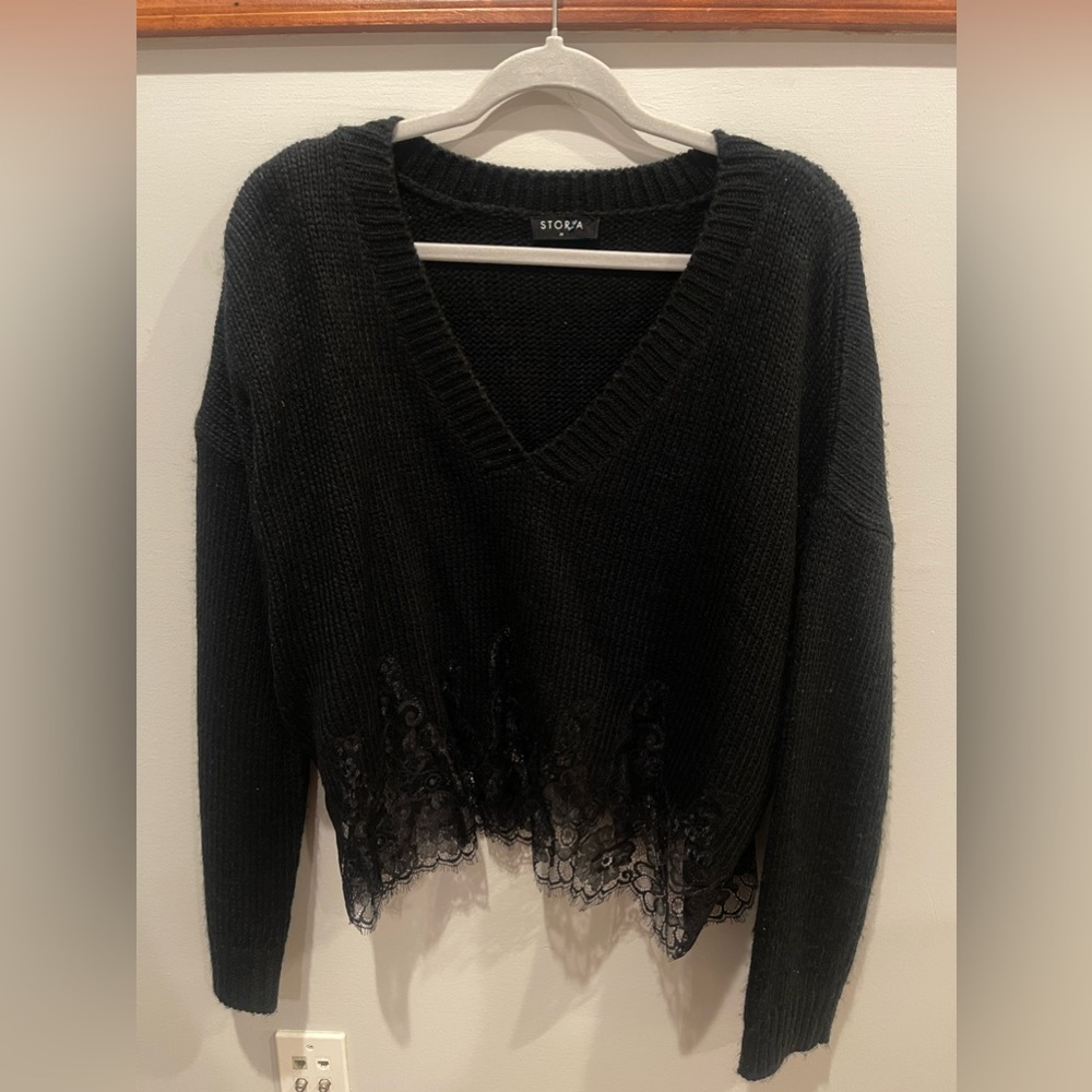 Women’s black sweater with lace detail bottom